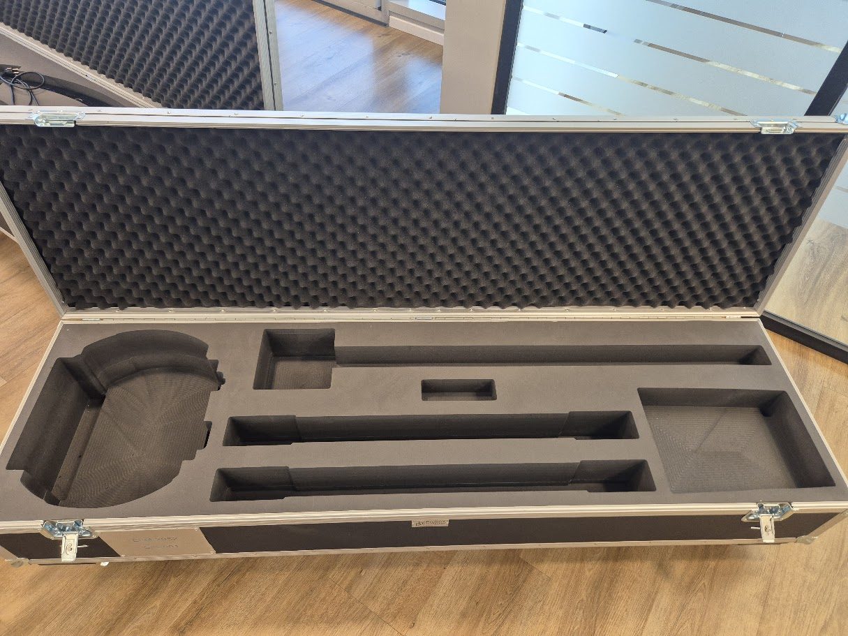 Long flight case with foam inserts cut to each component